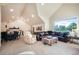 Spacious living room with vaulted ceilings, a large window, and an adjoining game area at 18330 Archers Dr, Monument, CO 80132