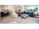 Open concept floorplan with vaulted ceilings, recessed lighting, a leather sofa, and a bar area at 18330 Archers Dr, Monument, CO 80132