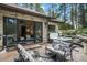 Outdoor patio space with a hot tub and an outdoor seating area with access to the main bedroom at 18330 Archers Dr, Monument, CO 80132