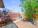 Fenced backyard with trees, bushes, and mulch, offering a private outdoor space at 3450 N Harrison St, Denver, CO 80205
