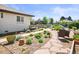 Backyard featuring stone landscaping and a walkway, a seating area and mature plants at 3450 N Harrison St, Denver, CO 80205