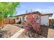 Landscaped backyard area showcasing the exterior of the home and a privacy fence at 3450 N Harrison St, Denver, CO 80205