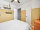 Bright bedroom with wall shelves, neutral colors, ceiling fan, and comfortable bedding at 3450 N Harrison St, Denver, CO 80205