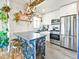 Modern kitchen with white cabinets, stainless steel appliances, and a stylish island at 3450 N Harrison St, Denver, CO 80205