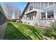 Expansive backyard features lush grass, a patio set, and a glimpse of the home's unique architecture at 1065 Jackson St, Denver, CO 80206