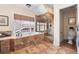 Luxurious bathroom featuring a soaking tub, a separate shower, and warm tile flooring at 1065 Jackson St, Denver, CO 80206