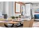 Contemporary dining area featuring a modern table setting and a glimpse of the adjacent kitchen at 1065 Jackson St, Denver, CO 80206