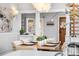 Elegant dining room with modern chandelier and a glimpse of the living area through an archway at 1065 Jackson St, Denver, CO 80206