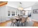 Dining room with seating for six, a modern light fixture, and natural light at 1065 Jackson St, Denver, CO 80206