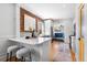 Well-appointed kitchen with quartz countertops, stainless steel appliances, and an adjacent dining area at 1065 Jackson St, Denver, CO 80206