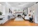 Bright living room featuring hardwood floors, a fireplace, and built-in bookshelves at 1065 Jackson St, Denver, CO 80206