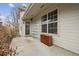 Covered back patio with storage and a door leading inside at 2449 Xanthia St, Denver, CO 80238