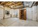 Unfinished basement with wood beams, concrete floor, and a sauna at 2449 Xanthia St, Denver, CO 80238