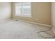 Neutral carpeted bedroom with double-hung windows offering great natural light at 2449 Xanthia St, Denver, CO 80238