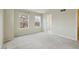 Carpeted bedroom with a door and two large windows offering natural light at 2449 Xanthia St, Denver, CO 80238