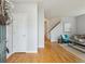 Welcoming entryway showcasing hardwood floors and convenient access to the living areas at 2449 Xanthia St, Denver, CO 80238