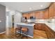 Well-equipped kitchen with granite countertops, stainless steel appliances, and wooden cabinets at 2449 Xanthia St, Denver, CO 80238