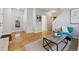 Spacious living room with hardwood floors, neutral walls, and ample space for entertaining at 2449 Xanthia St, Denver, CO 80238