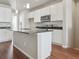 Modern kitchen with white cabinets, granite countertops, and an island at 457 Interlocken Blvd # 102, Broomfield, CO 80021