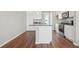 Modern kitchen with white cabinets, granite countertops and stainless steel appliances at 457 Interlocken Blvd # 102, Broomfield, CO 80021
