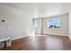 Bright and spacious living room with hardwood floors and large windows at 457 Interlocken Blvd # 102, Broomfield, CO 80021