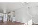 Open concept living room and kitchen with hardwood floors and neutral colors at 457 Interlocken Blvd # 102, Broomfield, CO 80021