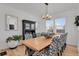 Bright dining room with wood flooring, large dining table, and a chandelier at 897 E Rim Rd, Franktown, CO 80116
