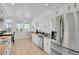 Bright kitchen with stainless steel appliances, tile flooring, and mountain view at 897 E Rim Rd, Franktown, CO 80116