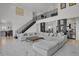 Spacious living room with stylish decor and staircase to the loft at 897 E Rim Rd, Franktown, CO 80116