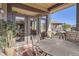 Relaxing covered patio with comfortable seating and an outdoor dining area at 23960 E Easter Pl, Aurora, CO 80016