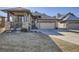 Charming single-Gathering home with a stone facade, covered porch, and well-manicured lawn at 23960 E Easter Pl, Aurora, CO 80016