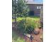 Landscaped garden bed featuring vibrant perennials, mulch, and decorative stones, adding curb appeal to the property at 23960 E Easter Pl, Aurora, CO 80016