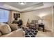 Comfortable home office with a large window, neutral carpet, and built-in shelving at 23960 E Easter Pl, Aurora, CO 80016