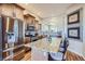 Gourmet kitchen featuring stainless steel appliances, granite countertops, and custom cabinetry at 23960 E Easter Pl, Aurora, CO 80016