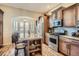Modern kitchen boasting granite countertops, a stainless steel refrigerator, and hardwood floors at 23960 E Easter Pl, Aurora, CO 80016