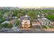 Wide aerial shot of townhomes in a neighborhood, showcasing proximity to urban skyline and green spaces at 1048 Knox Ct, Denver, CO 80204