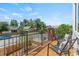 Relaxing balcony with outdoor seating overlooking the neighborhood and blue sky at 1048 Knox Ct, Denver, CO 80204