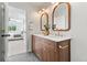 Stylish bathroom with a double sink vanity, marble countertop, and modern fixtures at 1048 Knox Ct, Denver, CO 80204