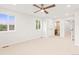 This bright bedroom has a ceiling fan, two windows and two doorways at 1048 Knox Ct, Denver, CO 80204
