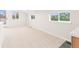 Spacious bedroom with neutral carpeting and multiple windows offering natural light at 1048 Knox Ct, Denver, CO 80204