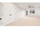 This bedroom boasts a ceiling fan, double doors and a door to the outside at 1048 Knox Ct, Denver, CO 80204