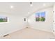 Light-filled bedroom with vaulted ceiling, neutral carpeting and multiple windows at 1048 Knox Ct, Denver, CO 80204