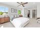 Comfortable bedroom with carpet floors, ceiling fan, and ensuite bathroom at 1048 Knox Ct, Denver, CO 80204