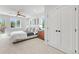 Bright main bedroom with a ceiling fan, large windows, and access to a balcony at 1048 Knox Ct, Denver, CO 80204