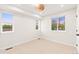 Bedroom with carpet, windows, overhead lighting, and modern ceiling fan at 1048 Knox Ct, Denver, CO 80204
