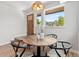 Cozy dining area with a round table, modern chairs, and natural light at 1048 Knox Ct, Denver, CO 80204