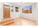 Welcoming entryway with beautiful hardwood floors, lots of light, and decorative windows at 1048 Knox Ct, Denver, CO 80204