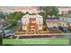 Newly constructed townhomes featuring a charming brick and siding exterior with fenced front yards at 1048 Knox Ct, Denver, CO 80204