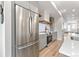 Modern kitchen with stainless steel appliances and bright, open layout at 1048 Knox Ct, Denver, CO 80204