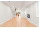Long view of open living space and view into the kitchen, fireplace, and staircase at 1048 Knox Ct, Denver, CO 80204